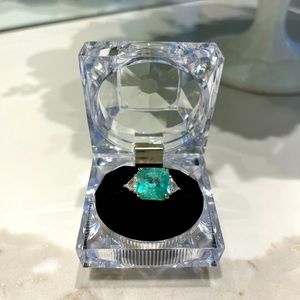 Ladies emerald and diamond ring